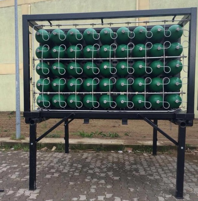 Green CNG cylinders arranged in black frame structure