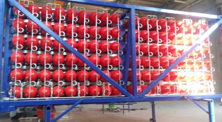 Red CNG cylinders in blue frame structure with diagonal bracing