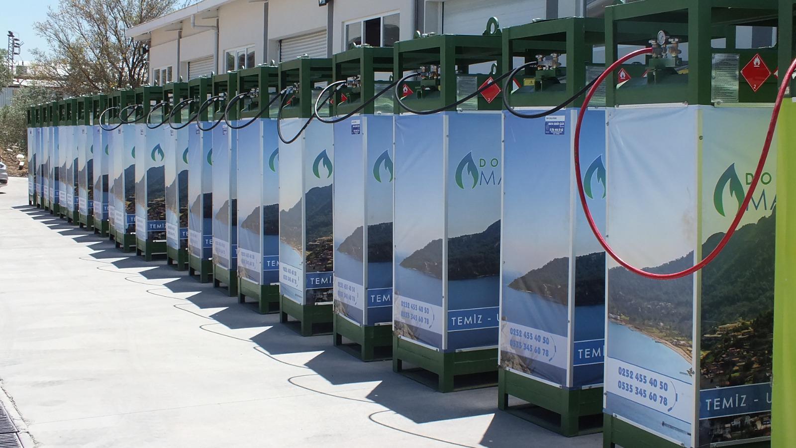 DOMA branded CNG dispensers with scenic lake graphics and clean energy messaging