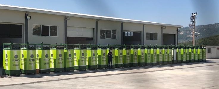 Extended row of ERD branded CNG dispensers outside industrial facility